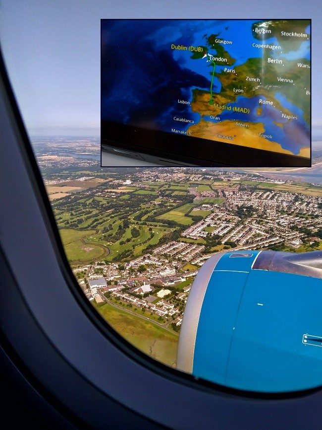 Picture looking out of a window plane, flying to Ireland